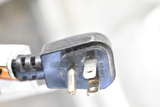 Close-up of a power plug for the Whirlpool ET1MHKXMQ08 Reach-In Cooler. Features a 115 Volt, 1 Phase connection.