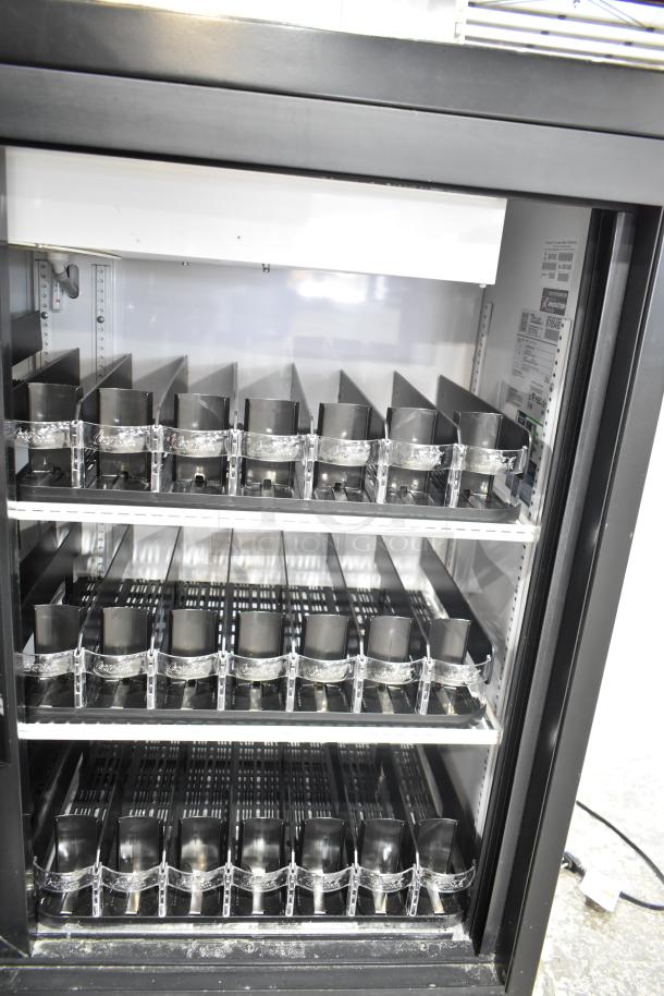 2020 True GDM-41SL-48-HC-LD commercial cooler, 2 glass doors, 115 volts, shelves with dividers, minor wear.