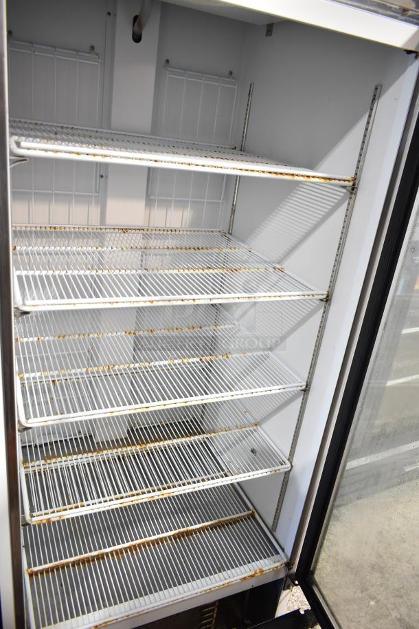 Habco SF28M commercial reach-in freezer. Single door, adjustable wire shelves, evident rust, 115V, 1 phase.