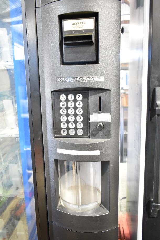 Crane 5800-4 metal vending machine with bill acceptor, keypad, and bottle compartment. 115 volts, 1 phase.