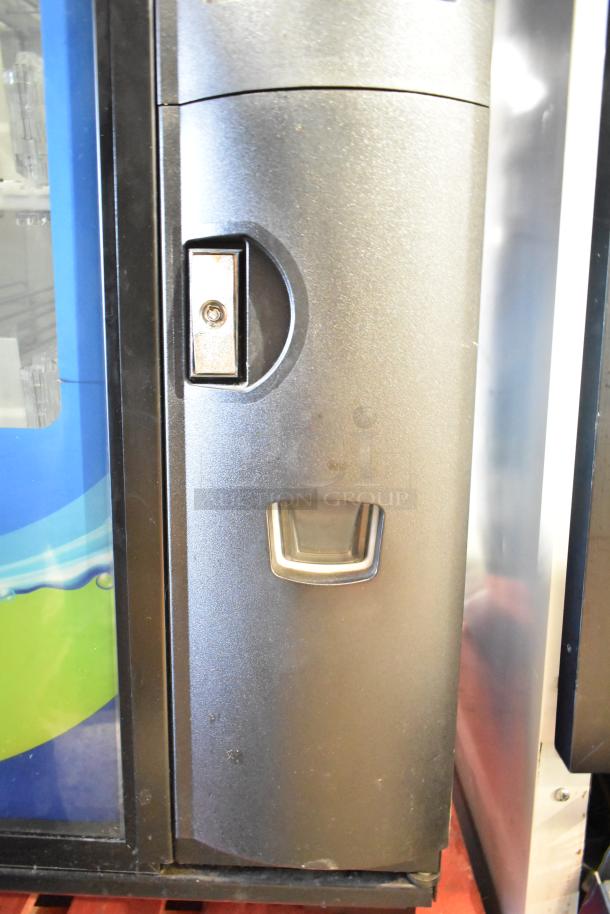 Crane 5800-4 metal commercial drink vending machine, features bill acceptor, operates on 115 volts, 1 phase power.