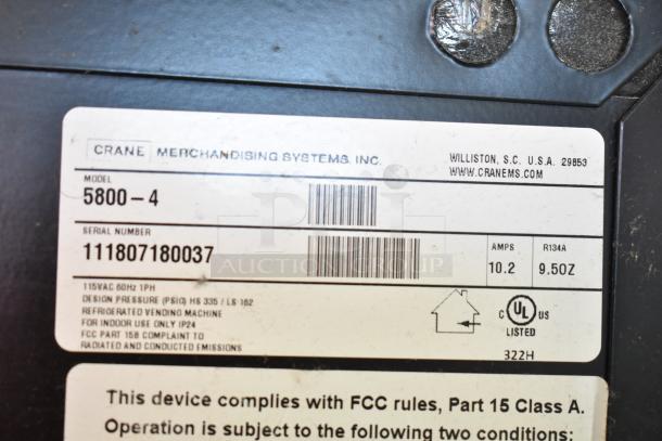 Crane 5800-4 metal vending machine label showing model, serial number, 115V spec, and UL compliance.