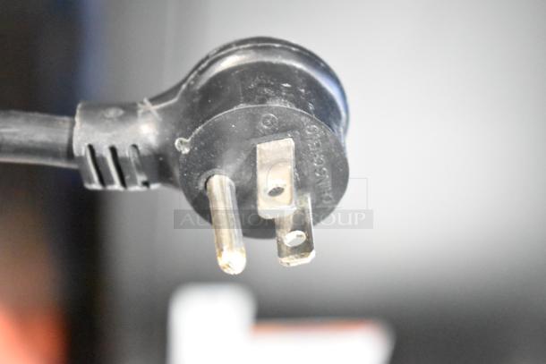 Close-up of a power plug for the 2021 True TVM-48SL-HC commercial cooler. 115 Volts, 1 Phase.