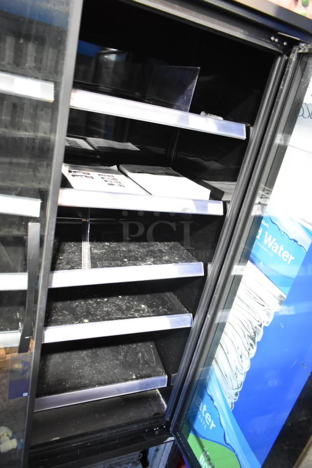 2021 True TVM-48SL-HC Commercial 2 Door Cooler, 115V, 1 Phase. Features adjustable shelves and visible wear.