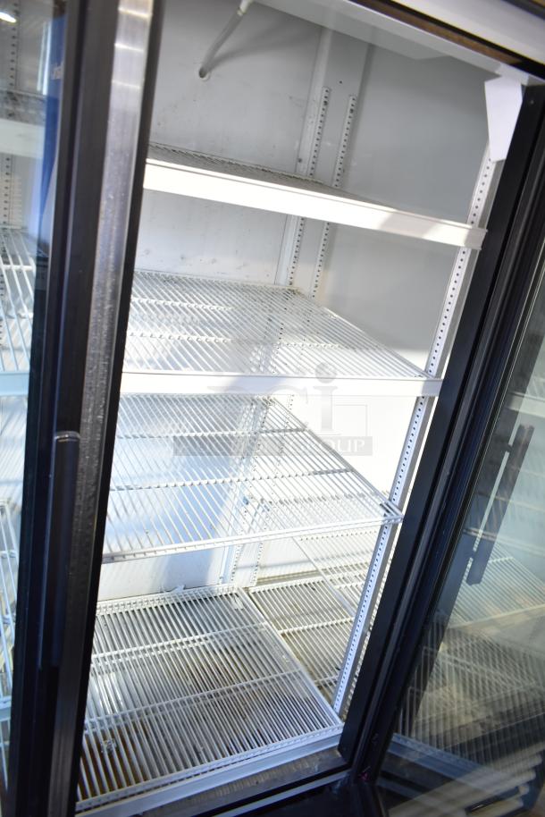 True GDM-72-HC-LD commercial cooler, 3-door, reach-in model with adjustable shelving. 115V, 1 Phase, clean interior.