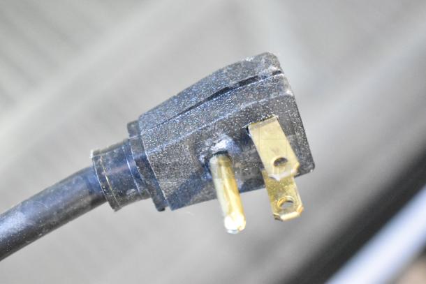 Close-up of a power plug for the True GDM-72-HC-LD cooler; shows 115-volt, 1-phase compatibility.