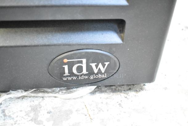 IDW GCG-10-F2334B logo on the base of a commercial single door cooler merchandiser.