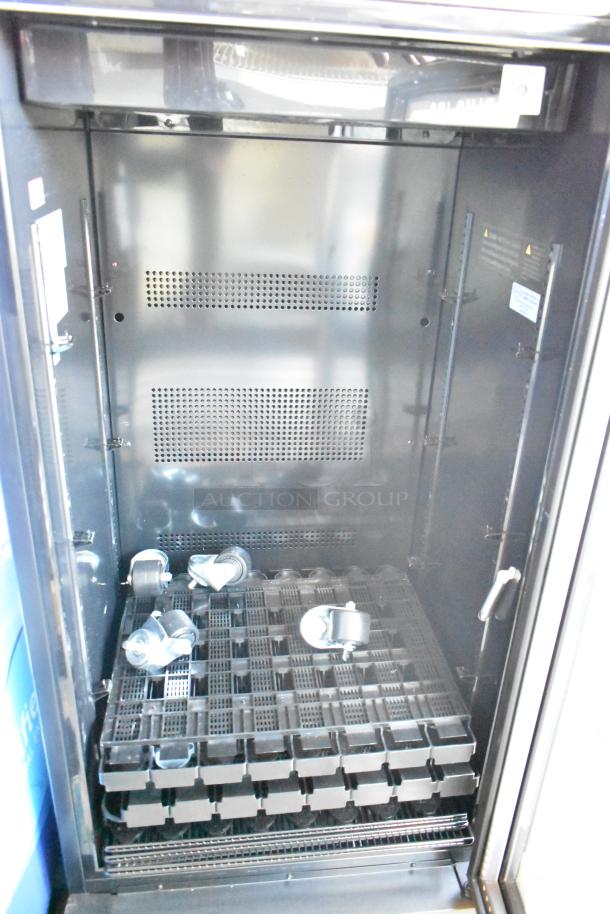 IDW GCG-10-F2334B commercial single door reach-in cooler merchandiser, 110-120 volts, 1 phase, interior view, includes casters.