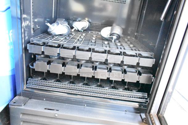 IDW GCG-10-F2334B Single Door Reach In Cooler interior with shelves and caster wheels, 110-120V, 1 Phase.