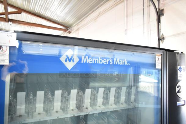 Crane 5800-4 vending machine, metal, bill acceptor, 115V, 1 phase, clear glass front, Member's Mark logo.