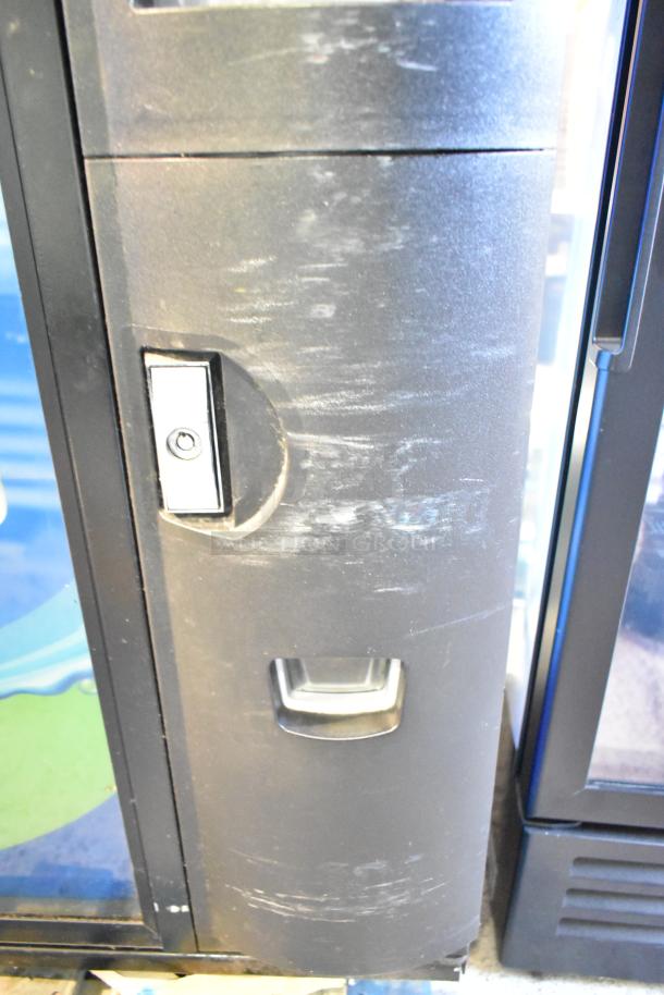 Crane 5800-4 Metal Commercial Bottled Drink Vending Machine, visible wear, includes bill acceptor. 115 Volts, 1 Phase.