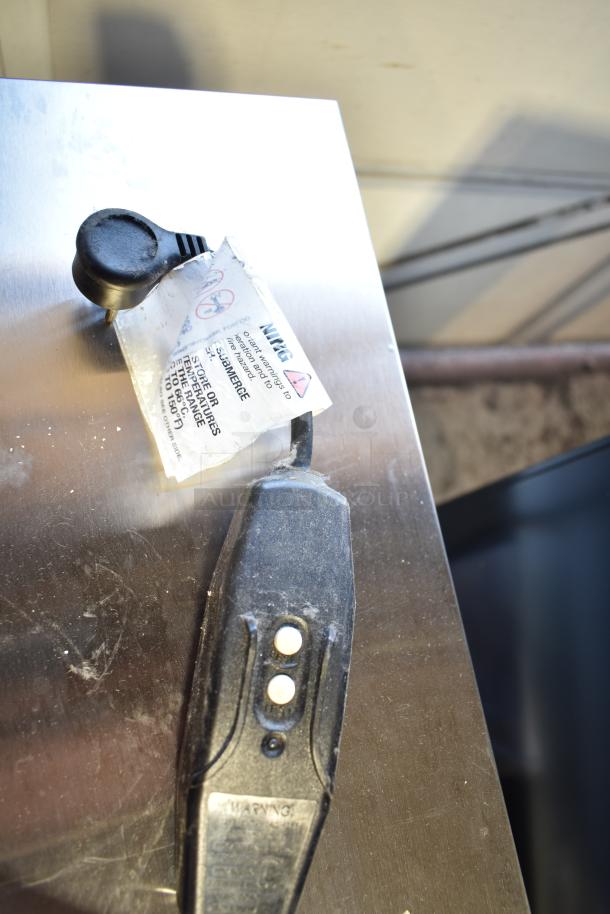 Crane 5800-4 vending machine power cord with attached tag, indicating storage instructions and voltage safety warnings.