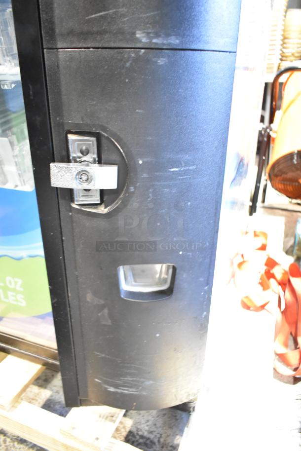 Crane 5800-4 metal commercial drink vending machine with visible bill acceptor, 115 volts, 1 phase. Used condition.