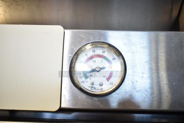 True Commercial 3 Door Reach In Cooler thermometer detail. Stainless steel. 115 Volts, 1 Phase. Model features True branding.