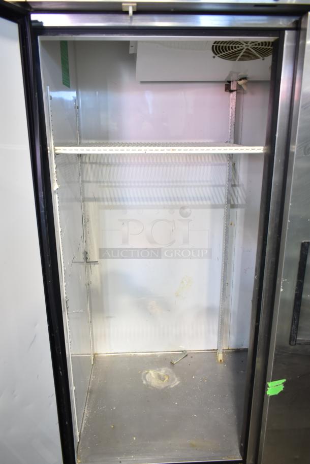 True Commercial 3 Door Reach-In Cooler, 115V, 1 Phase, stainless steel interior, adjustable shelving, used condition.