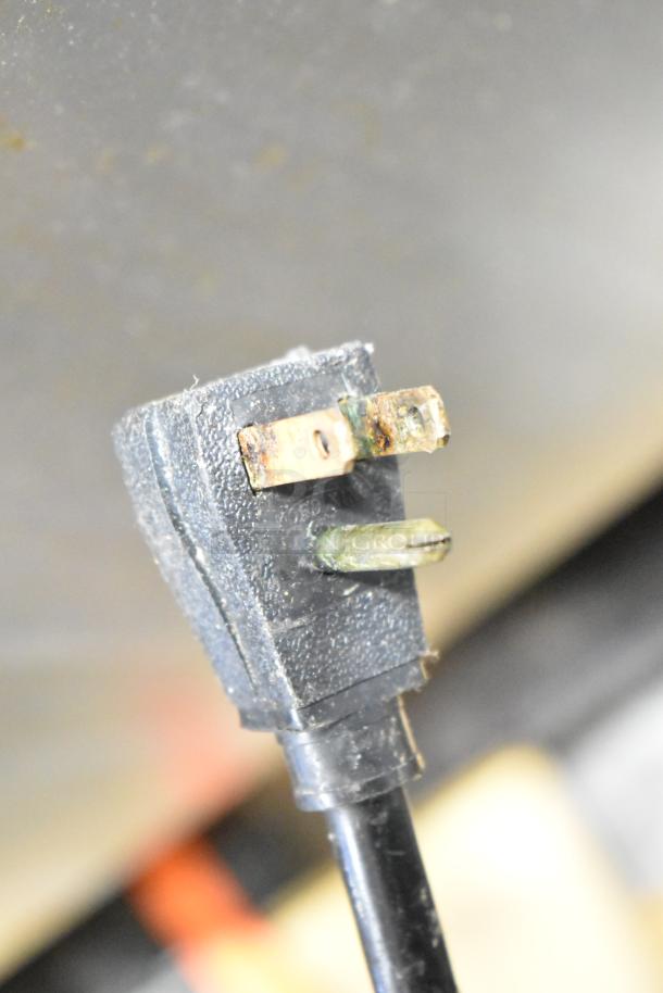 True Commercial 3 Door Reach In Cooler plug, 115 volts, 1 phase, visible wear on prongs.