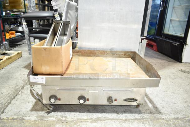 Star Commercial Countertop Electric Flat Top Griddle, features stainless steel surface, visible wear, and control knobs.