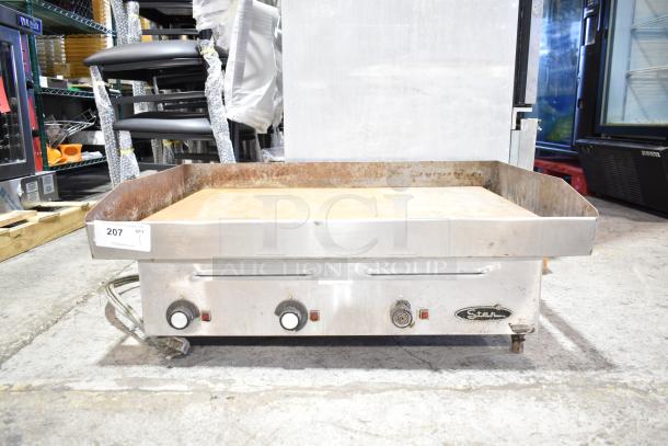 Star Commercial Electric Flat Top Griddle; used condition, stainless steel, visible rust on guard, adjustable knobs, model label present.
