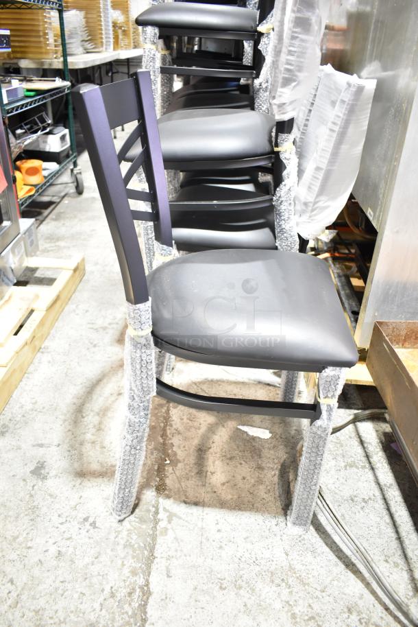 Lancaster Table & Seating black cross back dining chair, new condition, cushioned seat, scratch and dent, 14 available.