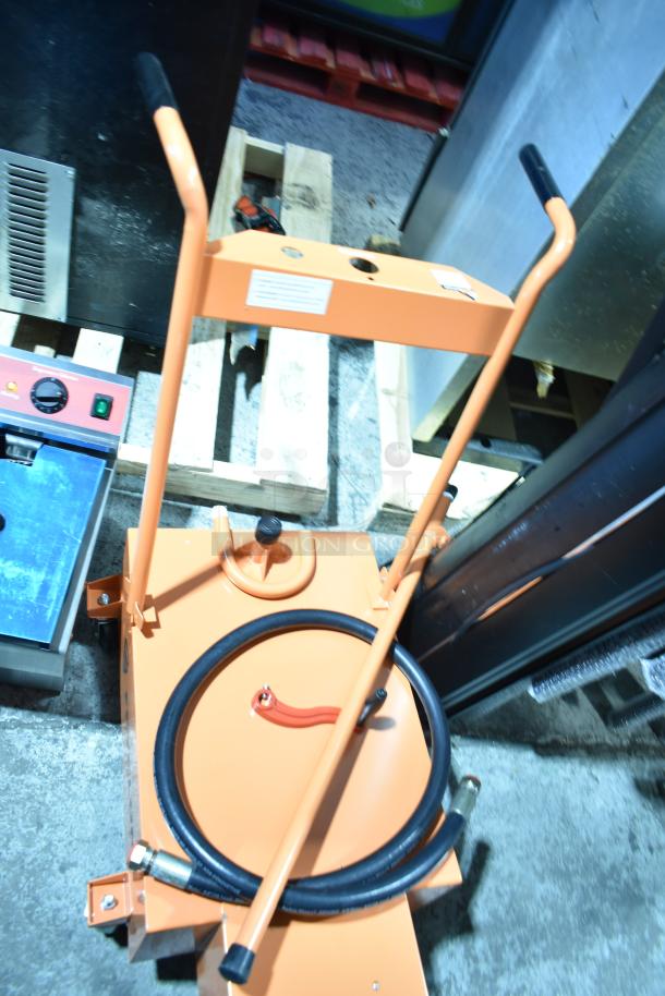 BRAND NEW SCRATCH AND DENT Fryclone 100 lb. Fryer Oil Disposal Unit, orange, includes hose and handle, slight cosmetic imperfections.