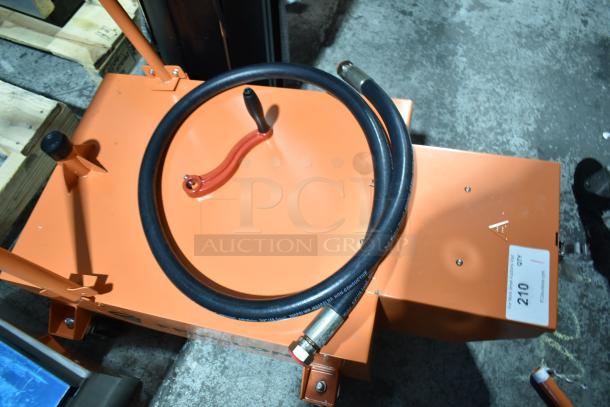 BRAND NEW Fryclone 100 lb. Fryer Oil Disposal Unit in orange. Includes hose and handle. Slight scratches visible.