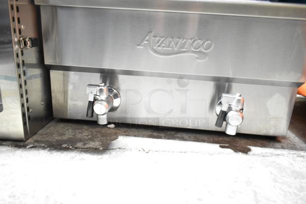 Brand new Avantco 177F202 dual tank electric fryer, 30 lb capacity, stainless steel, includes 2 metal baskets and lids, 208-240V.
