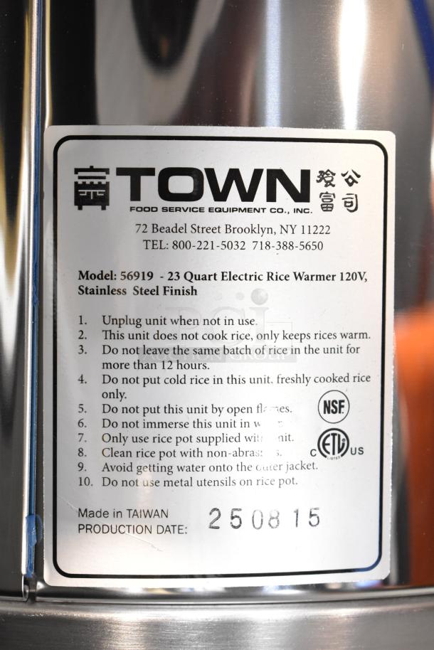 RiceMaster Town 56919 92 Cup Commercial Rice Warmer, stainless steel finish, new condition, model and care instructions visible.