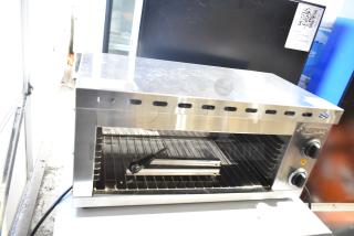 Brand new Avantco 177CHSME24IA 24" electric countertop cheese melter; scratch and dent, 120 volts, 1 phase, knobs visible.