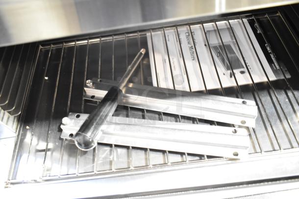 Brand new Avantco 177CHSME24IA 24" electric cheese melter, 120V, 1 phase, with grill accessories and manual inside.