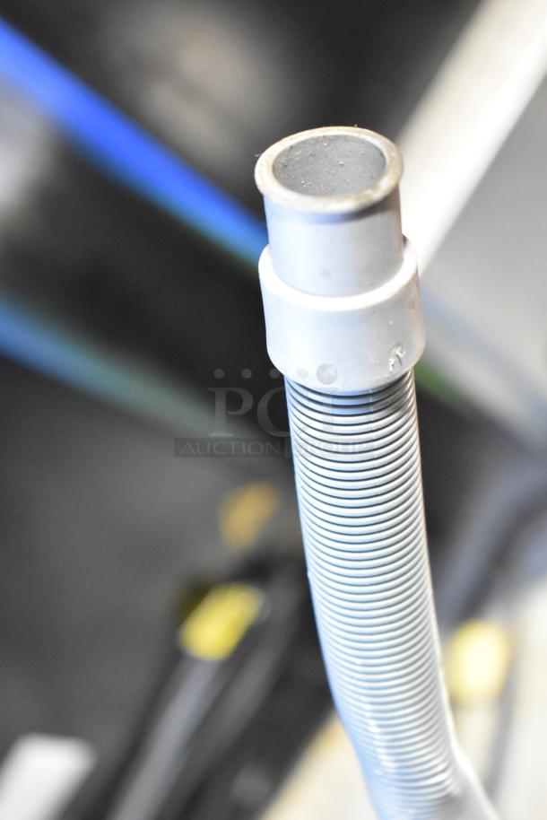 Close-up of a component from a 2025 Avantco 194UCH210A Commercial Ice Machine, highlighting tubing details.