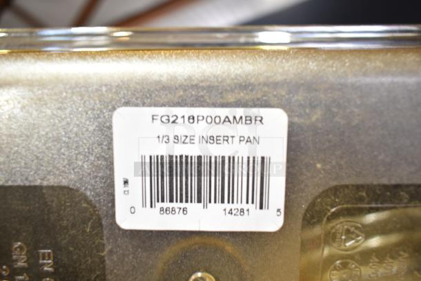 Lot of various items including a 1/3 size insert pan. Label reads "FG21P00AMBR." Condition appears gently used.