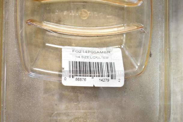 Clear plastic lid with barcode label "FG214P00AMBR, 1/4 Size Lid," part of a lot of bins and lids.