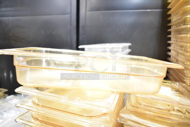 Lot of clear drop-in bins and lids, stacked. Used condition. Ideal for storage and organization.