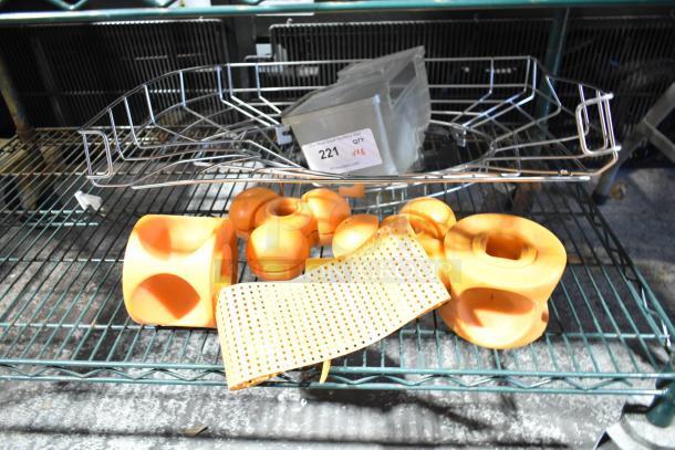 Eight assorted citrus juicer pieces in orange, various shapes, good condition, auction lot marked "221" at PCIAuctions.