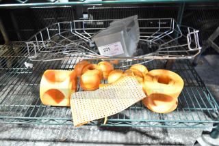 Eight assorted citrus juicer pieces in orange, various shapes, good condition, auction lot marked "221" at PCIAuctions.