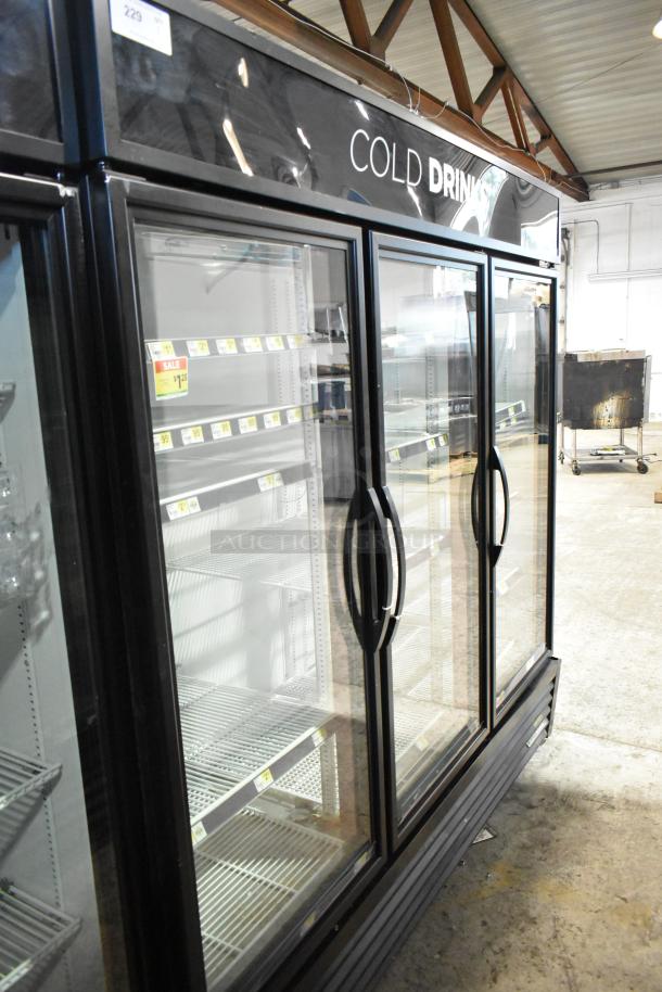 True GDM-72-HC commercial cooler, 3 glass doors, black frame, shelving inside, 115V, 1 phase, labeled for cold drinks.