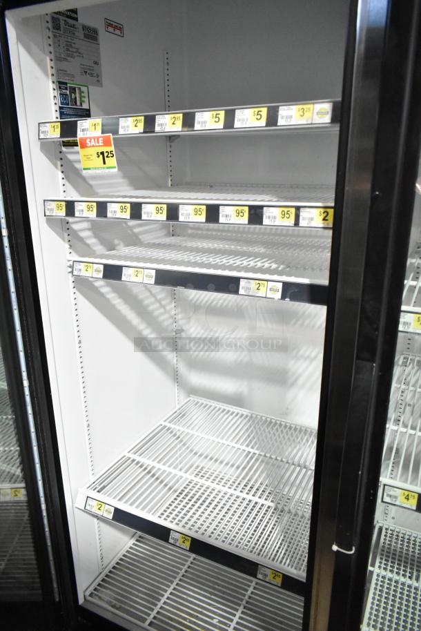 True GDM-72-HC Commercial 3 Door Cooler, shelves with price tags, clean interior, 115 Volts, 1 Phase, like new condition.