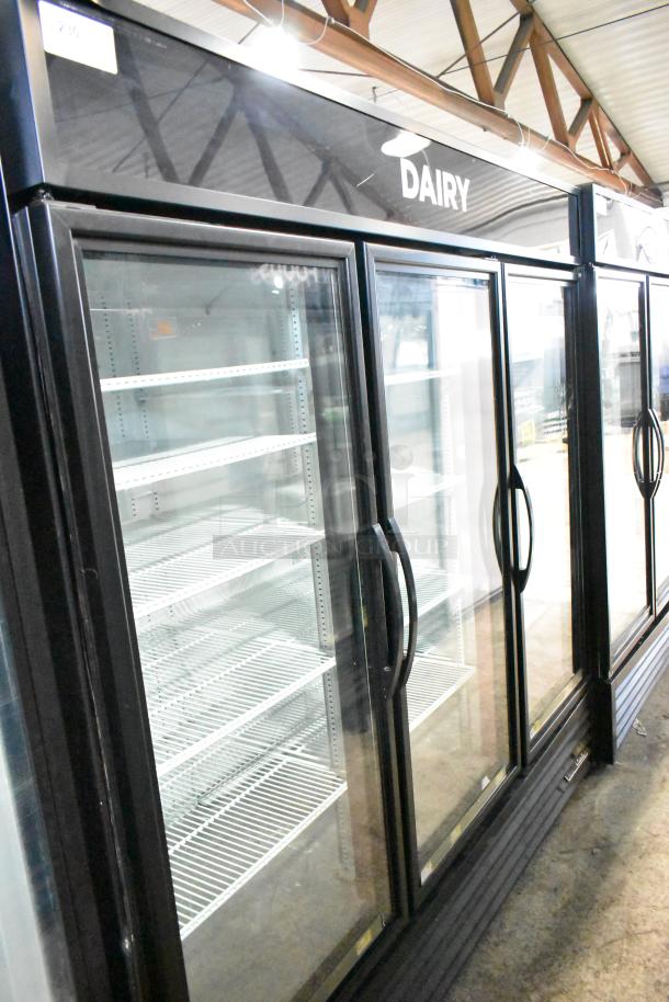 2018 True GDM-72-HC 3-door reach-in cooler merchandiser, black finish, with glass doors, shelves, 115 volts, 1 phase.
