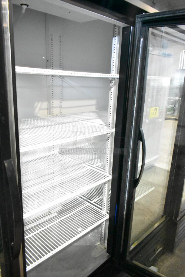 2018 True GDM-72-HC 3 Door Reach-In Cooler Merchandiser, 115 Volts, 1 Phase. Clean with adjustable shelves.