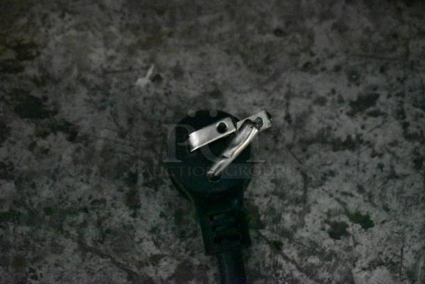 Close-up of an electrical plug on a 2018 True GDM-72-HC Commercial Cooler. Plug shows signs of wear.