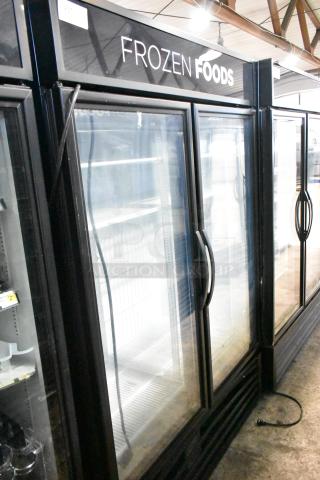 2020 True GDM-49F-HC commercial freezer, 2 glass doors, black frame, "Frozen Foods" sign, 115V, 1 phase.
