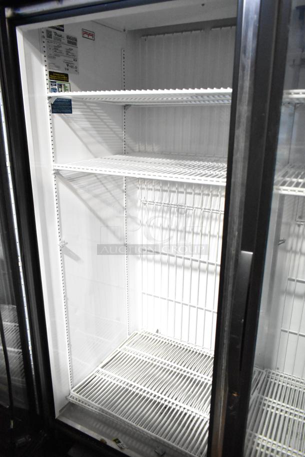 2020 True GDM-49F-HC 2 Door Reach In Freezer Merchandiser, 115V, 1 Phase, excellent condition, interior shelves, model label visible.