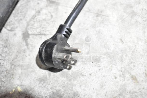 Close-up of a power plug for the 2019 True GDM-72-HC Commercial Cooler, 115 Volts, 1 Phase.