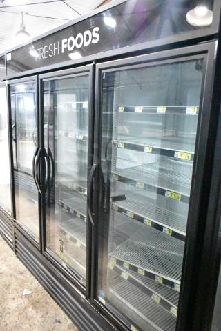 2019 True GDM-72-HC commercial 3-door reach-in cooler merchandiser, black exterior, glass doors, 115V, 1 phase.
