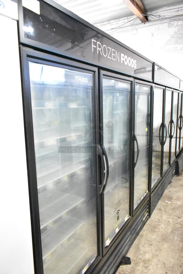 2019 True GDM-72F-HC commercial 3-door freezer merchandiser, 115 volts, in good condition. "Frozen Foods" label on top.