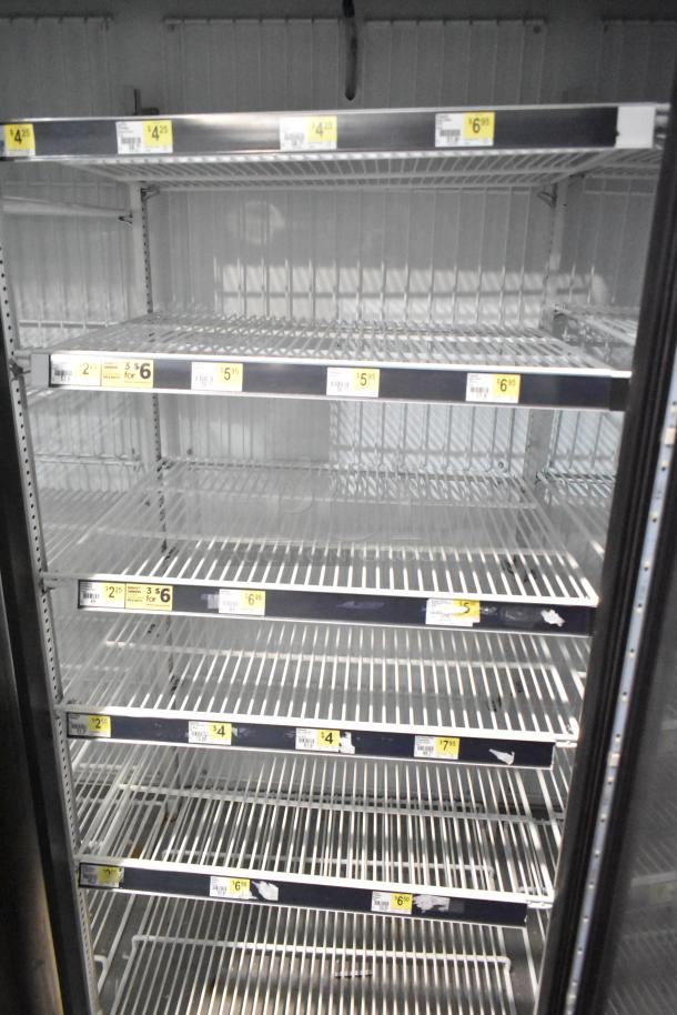 2019 True GDM-72F-HC commercial freezer, 3 glass doors, multiple metal shelves, 115 volts, 1 phase, good condition.