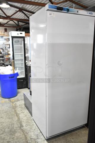 Brand new KoolMore KM-FMD20WH 21 Cu. ft. commercial freezer with minor scratches, 115 volts, 1 phase, model tag visible.
