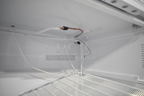Brand new KoolMore KM-FMD20WH 21 Cu. ft. commercial freezer interior; scratch and dent, 115V, 1 Phase, wires shown.