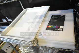 17 new scratch and dent items: 8 Choice 18"x12"x0.5" white polyethylene cutting boards, baking pans, and dough box lid.