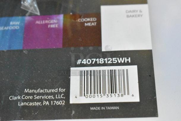 White polyethylene cutting board with barcode #40718125WH, manufactured by Clark Core Services, Made in Taiwan.